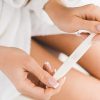 Woman Holding Pregnancy Test Hands