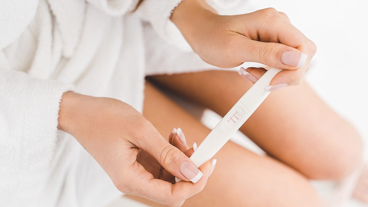 Woman Holding Pregnancy Test Hands